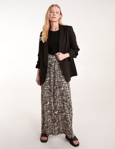 Whether you're vacationing or staycation-ing, these wide leg trousers are a staple pick. Finished with a flattering shirred waistline, they're also illuminated by the abstract print, perfect on those warm weather days. Partner with gold sandals to complete the look. 92% Polyester, 5% Elastane Made in ChinaMachine washableWide leg Shirred waistUnfastenedModel wears size SModels height: 173cm / 5ft 8 Chic Abstract Print Pants For Spring, Versatile Black Viscose Bottoms, Black Rayon Bottoms For Workwear, Casual Black Viscose Wide Leg Pants, Chic Black Viscose Pants, Black Viscose Wide Leg Pants For Spring, Chic Black Viscose Wide Leg Pants, Black Linen Trousers, Maternity Trousers