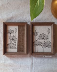 two wooden frames with flowers painted on them