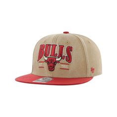 the chicago bulls snap back hat is tan and red