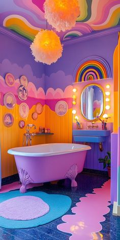 a bathroom decorated in pink, purple and yellow with a bathtub on the floor