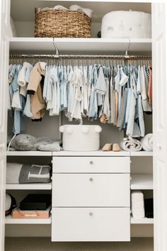 an organized closet with clothes and baskets