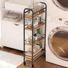 a washer and dryer sitting next to each other in front of a washing machine