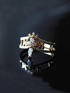 a close up of a ring on a black surface