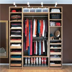 an organized closet with clothes and shoes