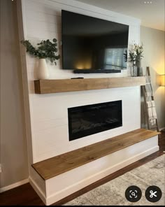 a flat screen tv mounted above a fireplace