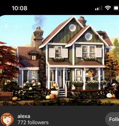 a large house with many windows and lots of plants in front of it, surrounded by fall foliage