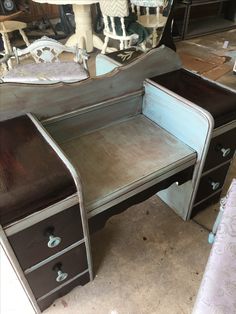 an old dresser with a mirror on top of it and other furniture in the background