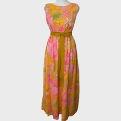 Vintage 1960s To 1970s Malia Honolulu Pink, Yellow And Green Oversized Floral Print Flowy Maxi Dress. 100% Nylon. Labeled A Size 8. Shown On A Size Small Mannequin. Seems Best For An Xs To S. Measurements Below: Chest: 32" Waist: 16.25" Length: 54" Has A Few Small Marks On Fabric (See Closeups), Not Super Obvious Since Fabric Is Flowy. I Did An At Home Dry Cleaning Kit But Did Not Try To Spot Treat. Belt Wraps Around And Attaches On The Underside Of The Bow. You May Want To Add A Snap To The Bac Pink Sleeveless Dress For Vintage Fashion, 1950s Pink Sleeveless Dress, Pink Sleeveless 1950s Dress, 1950s Style Pink Sleeveless Dress, Retro Summer Maxi Dress In Vintage Style, Retro Vintage Summer Maxi Dress, Mid-century Floral Print Dress For Spring, Mid-century Floral Print Spring Dress, Vintage Lined Pink Dress