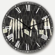 a black and white clock with roman numerals on the face that says time