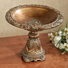 PRICES MAY VARY. The Giacinta Decorative Centerpiece Bowl has an antique appearance with the feeling of a prized family heirloom, passed on from generation to generation. Polystone centerpiece bowl features a bronze and gold finish. A medallion flower accents the inside center of the bowl. For decorative use only. Measures 14"dia.x11"H. Centerpiece bowl has classical designs and an antique look Can be used to hold your decorative accents Search A142 for the Giacinta Decorative Wall Shelf. The Gi Farmhouse Antique Decor, Centerpiece Bowls, Dough Bowl Centerpiece, Table Centerpiece Decorations, Tuscan Design, Mediterranean Home Decor, Wall Shelf Decor, World Decor, Tuscan Decorating