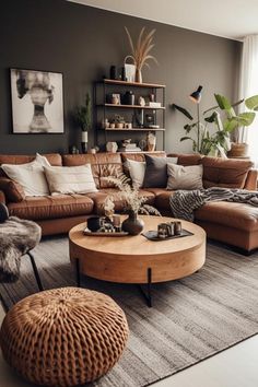 a living room filled with lots of furniture next to a wall mounted shelf full of potted plants