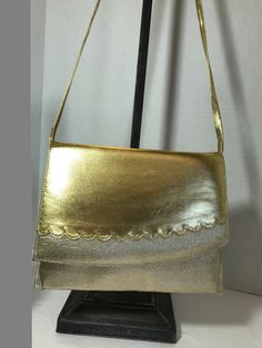 Vintage 1970s gold lame handbag purse, vintage 70s gold fabric and faux leather scalloped detail handbag purse clutch. Height 7" Width 8.5" Depth 1.5" Gold Lame, Purse Vintage, Gold Fabric, Purse Clutch, Handbag Purse, Vintage 1970s, Vintage 70s, Purses And Handbags, 1970s