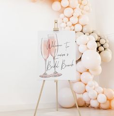 there is a sign that says welcome to the bride and groom with champagne glasses on it