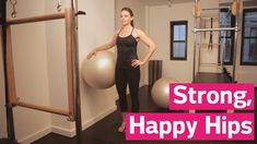 a woman standing in front of a gym ball with the words strong, happy hips