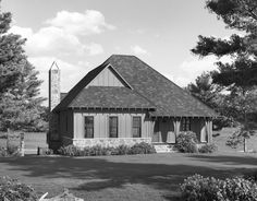 a black and white photo of a small house