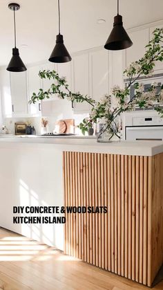 the kitchen island is made out of wood and has plants growing on top of it