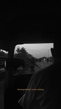 we keep holding on for nothing in this black and white photo taken from inside a car