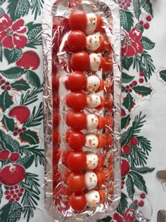 tomatoes and mozzarella are arranged in the shape of santa's helpers