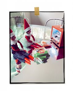 two elfs sitting on top of a table with carrots