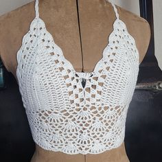 White crochet top boho bohemian top style - Coachella Ties around the neck and back to fit most sizes. It is crochet so it has holes and does not completely cover. I suggest wearing a bikini or bra underneath unless you wanna show your twins off.   Already made. Ship next day. White Crochet Lace Top For Beach Cover-up, Bohemian Lace Crop Top For Beach, Fitted Crochet Top For Summer Beach Cover-up, Fitted Crochet Top For Beach Cover-up, Fitted Open Knit Top As Beach Cover-up, Bohemian Lace Crop Top For Festival, Bohemian Crochet Lace Top For Beach, Beach Lace Crop Top With Crochet Trim, Bohemian Lace Crop Top With Crochet Trim