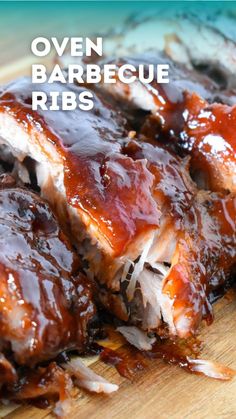 sweet sticky oven ribs on a cutting board with bbq sauce in the middle and text overlay that says sweet sticky oven ribs