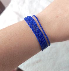 "Stunning royal blue bracelet constructed with 5 strands of high quality of seed beads. Available in several sizes and you can choose from silver or gold clasp. Find a fabulous matching necklaces here: https://www.etsy.com/shop/StephanieMartinCo/search?search_query=sapphire+blue+necklaceℴ=date_desc&view_type=gallery&ref=shop_search ❤ SIZES This item comes in several sizes, kindly choose at checkout. The standard size for an average woman is 7\". For a child, perhaps a 6\" would be appropriate. I Blue Multi-strand Bracelets With Tiny Beads, Blue Multi-strand Bracelet With Tiny Beads, Blue Multi-strand Beaded Bracelets With Tiny Beads, Blue Multi-strand Beaded Bracelets With Spacer Beads, Royal Blue Bracelet, Teal Bracelet, Beautiful Anklet, Blue Beaded Bracelets, Jewelry Essentials