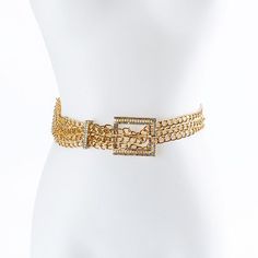 a white mannequin wearing a gold chain belt