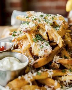 french fries with parmesan cheese and ketchup on the side