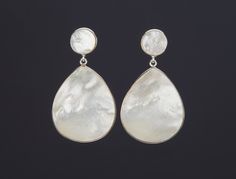 This pair of two tier Mother of pearl earrings would be great reward for yourself or a great gift for your mother or best friend. It has a small round MOP top in gold bezel and a very large MOP pendant at the bottom 1. Stone : Mother of pearl ( 11mm top, 37 x 26 mm pendant) 2. total length: about 51 mm 3. bezel material: gold vermeil or sterling silver 4. earring post: gold vermeil or sterling silver 5. an optional custom jewelry card printed with your own message, if you are sending these as a Elegant Mother Of Pearl Earrings For Anniversary, White High Luster Earrings For Anniversary, Pearl White Pierced Earrings For Gift, Pearl White Drop Clip-on Earrings As Gift, Pearl White Drop Clip-on Earrings For Gift, Elegant Mother Of Pearl Earrings As Gift, High Luster Drop Pearl Earrings For Gift, High Luster Drop Earrings For Gift, Nickel-free Teardrop Pearl Earrings For Anniversary