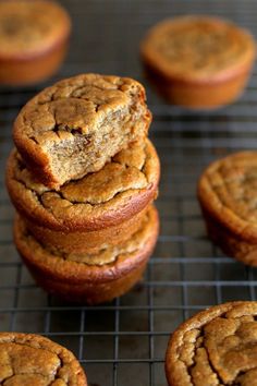 several cookies stacked on top of each other on a cooling rack with one cookie in the middle