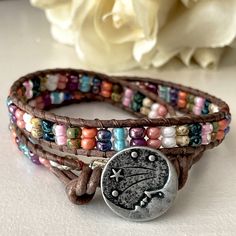 Iridescent Miyuki Seed Beads Are Stitched Onto Mocha Brown Leather Cord And Secured With A “Starry Nights Man In The Moon” Silver Pewter Button Closure. The Bracelet Measures 15 1/2 Inches Long And Has Two Knots At The End For Size Adjustment. Designed And Handcrafted By Me. Organza Jewelry Bag Included For Gift Giving Or Safe Keeping. Free Gift With Purchase! Fast Shipping! Bundle With Something Else In My Closet To Save More! Organza Jewelry, Leather Beaded Bracelet, Leather Cord Jewelry, Jump Ring Jewelry, Suede Jewelry, Suede Bracelet, Jewelry Making Business, Brighton Bracelets, Leather Bracelets Women