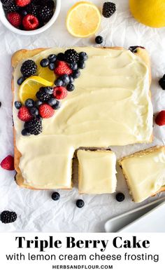 a lemon cream cheese frosting cake with berries and raspberries on the side