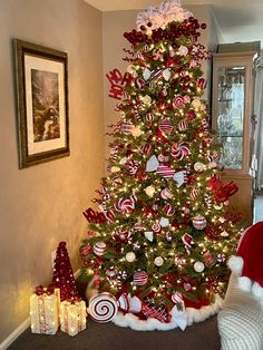 a christmas tree decorated with candy canes and ornaments