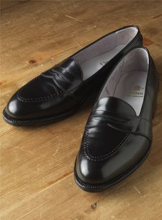 Classic Black Slip-ons With Brogue Detailing, Classic Black Slip-on Tassel Loafers, Classic Black Slip-ons With Leather Sole, Classic Black Loafers With Leather Footbed, Black Goodyear Welted Slip-ons For Work, Classic Tassel Loafers With Leather Sole For Galas, Classic Tassel Loafers With Leather Sole, Classic Goodyear Welted Slip-on Tassel Loafers, Classic Brogue-detailed Moccasins For Galas