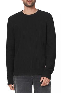 A soft, waffle-textured cotton knit brings exceptional comfort to a T-shirt styled with a slouchy fit and thumbholes to hold the sleeves in place. 27" length (size Medium) Crewneck Long sleeves with thumbhole cuffs 70% cotton, 30% recycled cotton Machine wash, dry flat Imported Black Ribbed Cotton Sweater, Ribbed Crew Neck Tops For Winter, Relaxed Fit Waffle Knit T-shirt With Crew Neck, Casual Solid Sweater With Ribbing, Black Ribbed Crew Neck Top, Black Ribbed Top For Streetwear, Black Ribbed Tops For Fall, Casual Waffle Knit Crew Neck T-shirt, Relaxed Fit Waffle Knit Crew Neck Top