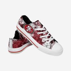 The world is your canvas - Make sure it's a colorful one! Take the next step towards proving you're the grooviest fan around with these San Francisco 49ers Women's Low Top Tie Dye Canvas Shoes! Features Team-colored tie dye design for plenty of funky fresh fandom Team logo display on side and tongue, in case there were any doubts where your allegiances lie Low-top style to make you look good from head to toe Adjustable laces for security, so get ready to lace up Closed, round toe design that wil Dye Canvas Shoes, Dallas Cowboys Shoes, Cowboy Shoes, Nfl Teams Logos, Toes Designs, Tie Dye Designs, Self Service, Kids Luggage, San Francisco 49ers