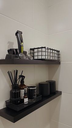 the shelves in the bathroom are filled with various items such as soap, toothbrushes and candles