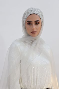 Gorgeous Embroidered Handmade Silver Turban is made with care and love and paired with a 100% Pure Soft Silk Shawl (28"x 72") or a Tulle Shawl (27"x72") for a more dramatic glimpse. You have the option to choose the look you’re looking for. This Silver Glow Set is perfect for an extremely elegant and royal look on your special occasions. Whether it’s for your wedding or engagement party it will add the wow factor to your look. Even if you decided to wear it as a bridesmaid or just for attending Elegant Shawl For Eid Celebration, White Pashmina Shawl For Wedding And Eid, White Shawl For Eid Wedding, White Headscarf For Wedding, Elegant White Headscarf For Wedding, Gold Hijab, Traditional White Hijab For Eid, Elegant White Wedding Headscarf, Silver Hijab