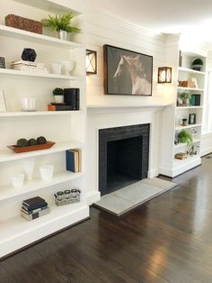 a living room filled with furniture and a fire place