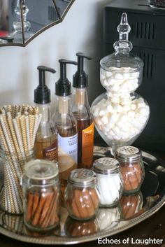 a tray filled with lots of different types of soaps and lotions on top of a table