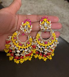 Earrings as seen on the pic Color yellow and gold Dangling drop earrings to go with any color combination  If you have any question feel free to contact me anytime.. thank you Handmade Yellow Bollywood Jewelry, Handmade White Kundan Danglers, Yellow Latkan Earrings For Party, Yellow Latkans Earrings For Wedding, Yellow Latkans Earrings For Party, Yellow Jewelry With Matching Earrings For Celebration, Yellow Drop Earrings For Wedding, Yellow Party Earrings With Latkans, Elegant Yellow Earrings For Festivals