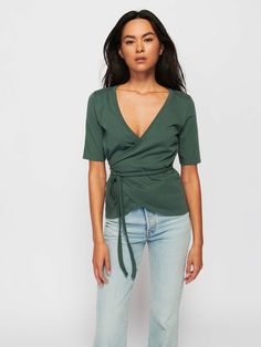 Because everyone needs an effortless wrap tee in their rotation. With a fully adjustable fit and a relaxed V neck, it's the perfect pair with your favorite vintage jeans for an easy off-duty outfit. (This one comes in Jade Stone.) | Women's Bianca Tee Top in Jade Stone | Ethical Essentials Wrap Shirt Outfit, Feminine V-neck Cotton Crop Top, Relaxed Cotton V-neck Top, Fitted Cotton V-neck Wrap Top, Green Relaxed Fit V-neck Blouse, Green Soft-washed Organic Cotton Tops, Nation Ltd, Off Duty Outfits, Neck Wrap