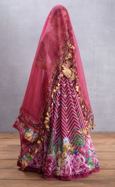 Editor's Note Featuring Manika Saadat Gul Lehenga Set Color: Ruby Red Fabric: Thin Handwoven Chanderi, Pure Cotton Silk, Dupion, Cancan, Sheer Silk Organza Components: Lehenga, blouse and dupatta Occasion: Sangeet Care: Dry Clean Only About the Designer Torani by Karan Torani stands handcrafted luxury inspired by the myriad tales of Indian mythology. Torani is a potpourri of all things nostalgic that binds you with a memory long forgotten. The label works with and revives timeless Indian textile Torani Designer, Indian Mythology, Blouse Yoke, Personal Shopping Service, Lehenga Blouse, Indian Textiles, Silk Organza, Red Fabric, Last Minute Gifts