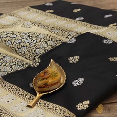 "A magnificent handloom masterpiece. A celebration of our heritage with design inspirations rooted in myriad textile traditions. This is a beautiful Katan silk saree with exquisite Kadhua bootis in roopa sona zari and a gorgeous aanchal adorned with paisleys.\n\n\n\n Color\u00a0- A ravishing shade of Black\n\n Technique\u00a0- An enduring Kadwa weave. The elaborate and laborious Kadwa (Kadhua) technique involves hand-weaving each motif separately. It takes longer on the handloom, but makes a more robust pattern, which stands out on the fabric.\n\n\n Fabric\u00a0- Soft as butter, pure Katan silk\n\n Speciality\u00a0- Exquisite individually woven bootis and a vintage-style, intricately woven border and pallu in gold and silver zari. This saree is ready to charm.\n\n\n Tilfi Promise\u00a0- Pu Color Of Night, Checks Saree, Black Pure, Dupion Silk, Katan Silk, Indian Saree, Organza Fabric, Saree Dress, Conscious Fashion