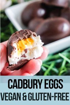 a person holding an egg in their hand with the words cadbury eggs vegan and gluten - free