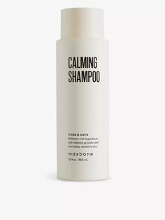 a bottle of calming shampoo on a white background