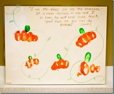 an art project with carrots painted on the wall and words written in green ink