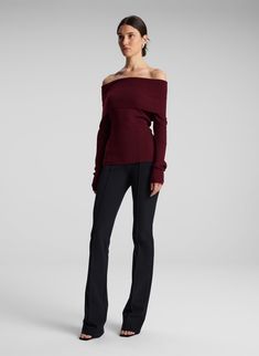 The Evelyn Top is crafted from stretch merino wool in a burgundy hue. This off-the-shoulder silhouette features a wide foldover detail that hits at the elbows and knuckle-grazing sleeves. This style runs true to size. Shop Tops, Styling Tip: Layer over a fluid skirt and slingback heels for an evening out. Burgundy Skirt Outfit, Plum Outfit, Baddie Outfit, Burgundy Skirt, Burgundy Top, Crochet Clothing, Shop Tops, Slingback Heels, Off Shoulder Top