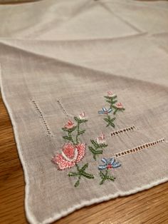 Pretty cotton handkerchief with hand sewn/embroidered pink flowers in one corner. Measures 10 inches x 10 inches  From England Excellent condition Spring Floral Embroidery Handkerchiefs As Gift, Floral Embroidered Handkerchiefs For Spring Gift, Spring Handkerchiefs With Floral Embroidery As Gift, Embroidered Pink Handkerchiefs For Gifts, Pink Embroidered Handkerchiefs For Gift, Spring Gift Handkerchiefs With Floral Embroidery, Vintage Pink Floral Embroidered Handkerchiefs, Spring Cotton Handkerchiefs With Floral Embroidery, Pink Vintage Handkerchiefs With Floral Embroidery