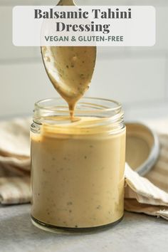 balsamic tahini dressing in a jar with a spoon